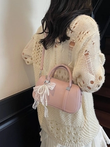 Pink lychee leather pillow bag with pearl charms and lace bow for women stylish look