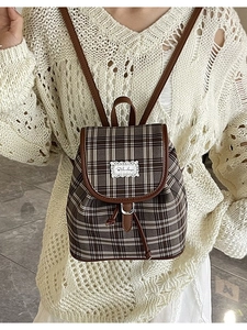 Vintage brown plaid canvas backpack with leather straps and drawstring closure for women