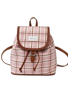 Pink and brown checkered canvas backpack with leather trim and drawstring flap closure