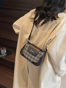 Chic plaid crossbody bag for women featuring black leather trim and adjustable strap