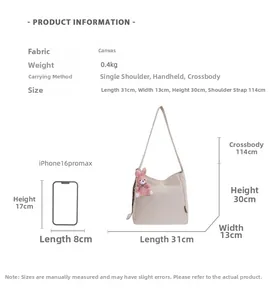 Detailed size specifications and carrying methods for this beige canvas tote bag