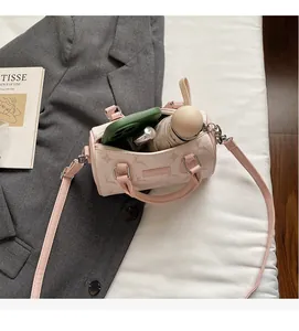 Pink Boston bag interior showing capacity for phone and folding umbrella