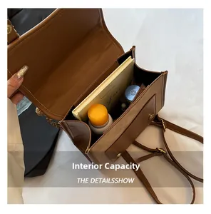 Internal capacity of the brown faux leather backpack showing space for essentials