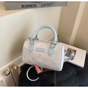 Close-up of light blue Boston bag featuring elegant deer print and litchi grain PU leather