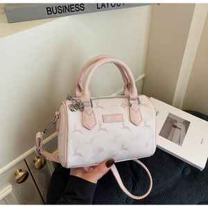 Close-up of pink deer print on Boston bag with dual handles and luxury texture detail