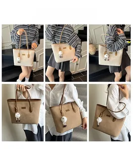 Detail view of large minimalist tote bag with retro color-block and plush lamb charm