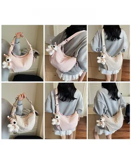 Detailed views of crossbody hobo bags in pink and beige with cute teddy bear pendants