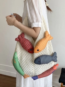 Chic off-white knitted tote bag with colorful 3D fish charms for summer vacation
