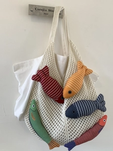 Knitted cotton mesh tote bag with five colorful fish-shaped plush hanging ornaments