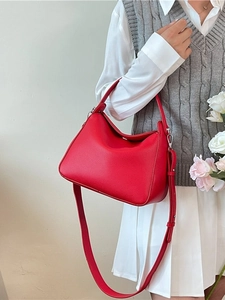 Red lychee grain leather hobo bag with adjustable shoulder strap and silver hardware