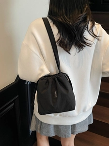 Minimalist large capacity black drawstring bucket bag with shoulder strap for women
