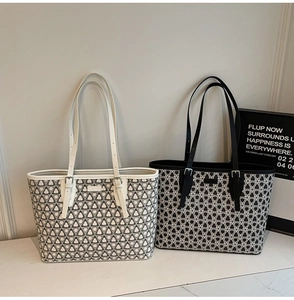 Detail view of large capacity tote bags with floral patterns and adjustable straps