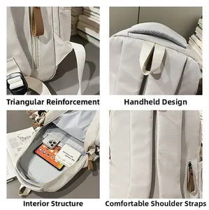 Detail view of reinforced stitching, mesh handle, and inner laptop compartment of the beige backpack