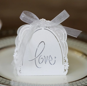 Detailed laser-cut wedding favor box with Love script and white organza ribbon bow