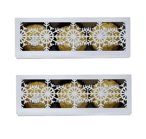 White Christmas candy box with laser-cut snowflake patterns for holiday party favors