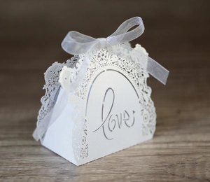 Detailed laser-cut white hollow wedding gift box with Love design and ribbon bow