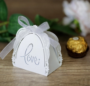White laser-cut candy box with Love lettering and lace pattern for wedding favors