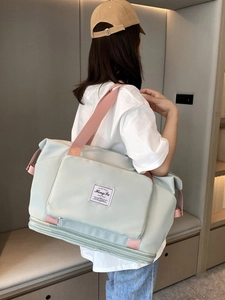 Waterproof mint green travel bag with pink straps shown in a modern lifestyle setting
