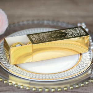 Detailed view of golden laser-cut LOVE wedding candy box with elegant hollow drawer design