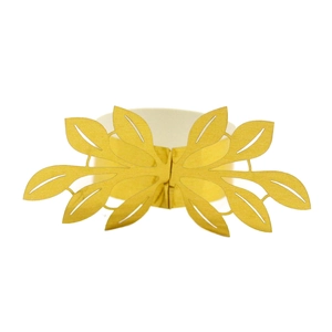 Detail of laser-cut golden paper napkin rings in a symmetrical leaf pattern for wedding