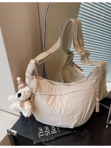 Chic beige large capacity crescent crossbody bag with cute plush bear keychain charm
