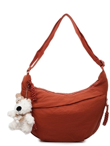 Brick red crescent nylon crossbody bag with adjustable strap and cute bear pendant