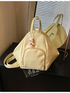 Creamy yellow multifunctional triangle backpack with cute rabbit charm and front pocket