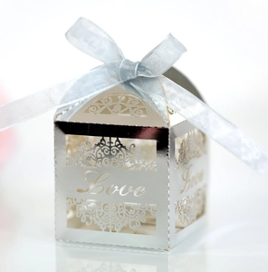 Detailed laser-cut silver candy box with Love lettering and light blue ribbon bow