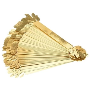 Detailed stacked view of shiny gold leaf paper napkin rings for wedding decor