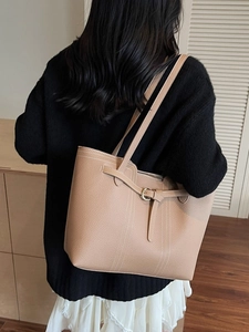 Minimalist light brown lychee grain leather tote bag for women with gold buckle accent