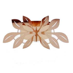 Detail view of a rose gold leaf-shaped napkin ring with hollow patterns on white background