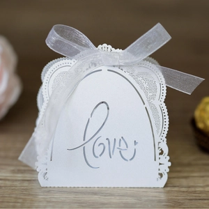 White laser cut lace candy box with Love lettering and ribbon for wedding favors