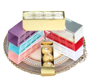 Laser-cut snowflake Christmas candy gift boxes in assorted metallic colors for holiday parties