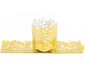 Macro shot of gold laser-cut hollow rose patterns on decorative paper lamp shade