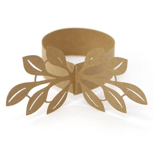 Detailed laser-cut hollow leaf pattern on brown kraft paper wedding napkin ring