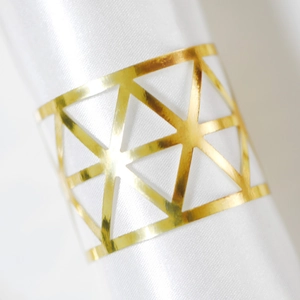 Golden geometric napkin ring with hollow triangle design for luxury dining table decor