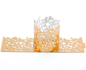 Detailed laser-cut hollow rose pattern on golden paper decorative candle cover wraps