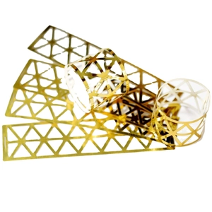 Golden hollow geometric metal napkin rings with mesh pattern for elegant table decor