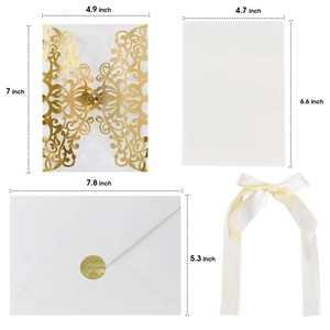 Macro detail of laser cut wedding invitation set with dimensions in rose gold and white