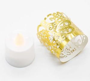 Detail of LED tea light with gold hollow-out heart and vine pattern decorative wrap