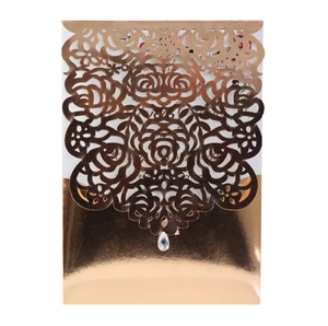 Hollow laser-cut rose gold wedding invitation cover with a teardrop crystal pendant