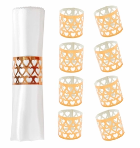 Detail of rose gold heart cutout paper napkin rings for wedding and dinner tables