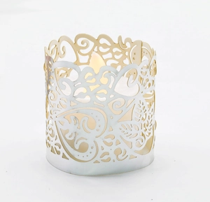 Detail of laser-cut maple leaf hollow metal lampshade with LED electronic candle light