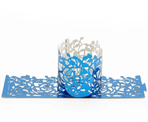 Detail of laser-cut rose and leaf patterns on dark blue metallic party lantern sleeve