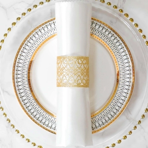 Detail of glitter champagne gold hollow-out napkin ring with laser-cut heart patterns