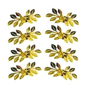 Set of eight golden leaf napkin rings with reflective metallic finish on white background