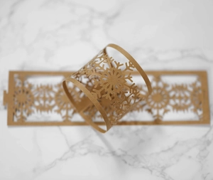 Detail of laser-cut snowflake napkin ring made of brown kraft paper for table decor
