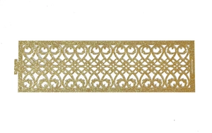 Detailed laser-cut gold glitter napkin ring with intricate European scroll pattern