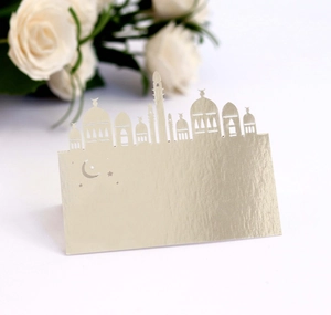 Detailed laser-cut gold place card with mosque silhouette for wedding or Ramadan events