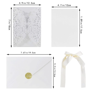 White laser-cut rose invitation card set with ribbon and envelopes for weddings